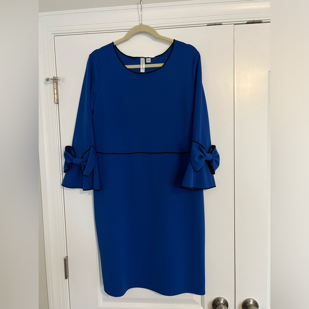 Blue dress with black trim and bow details
